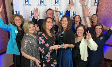 M1 team celebrates Big Business of the Year award.